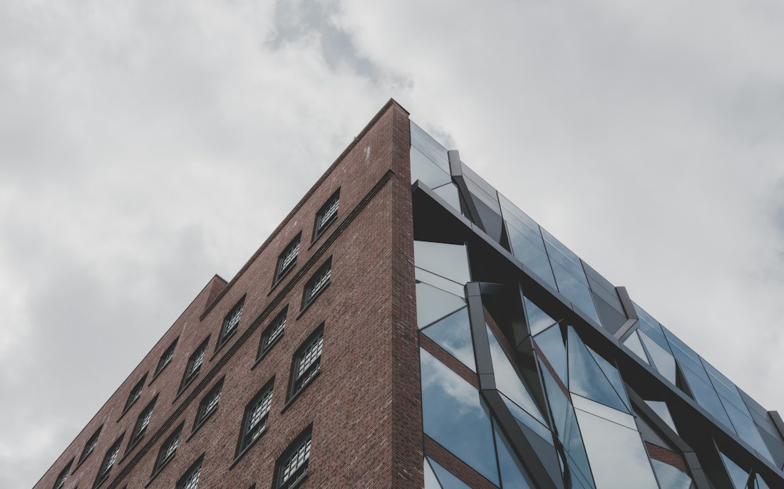 Modern building with brick, glazing and contrasting façade elements